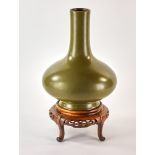 Chinese tea dust glazed porcelain vase, 13 1/2" H. With wood stand.