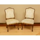 Pair of French Regency carved oak side chairs, 39 1/2" H x 22" W x 21 1/4" D.