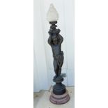 Cast iron sculpture of putto on marble base, electrified, 54" H.