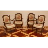 Set of four Louis XVI carved oak armchairs, 36" H x 23" W x 24" D.