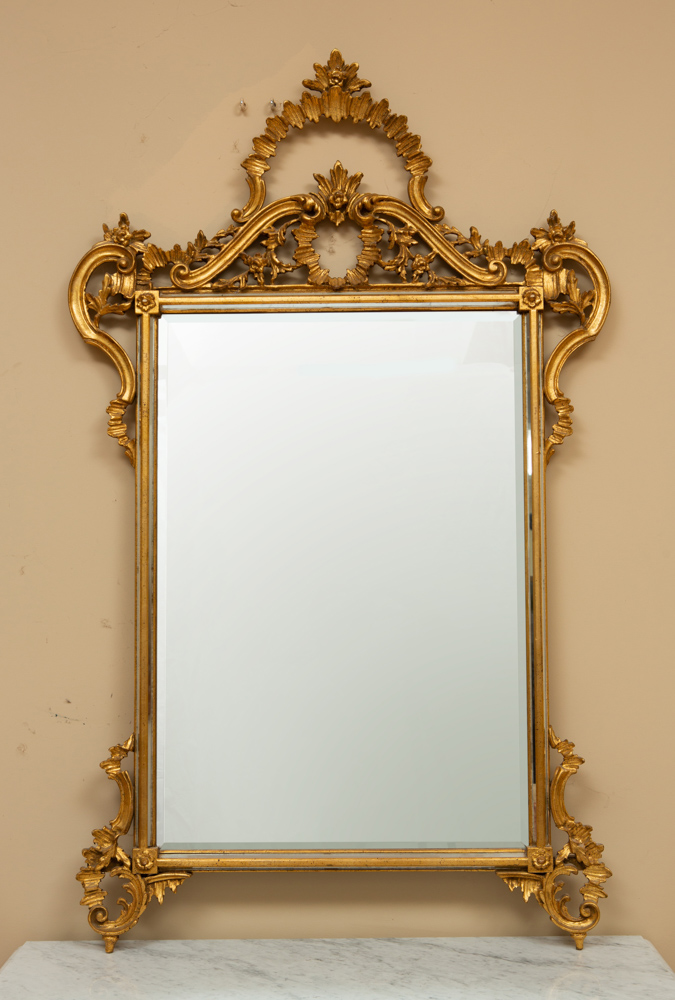 Venetian-style carved giltwood mirror, 53" H x 35 1/2" W.