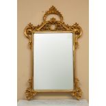 Venetian-style carved giltwood mirror, 53" H x 35 1/2" W.