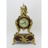 19th century French ormolu bronze clock, burgundy marble with cherub crest, 25" H x 14" x 8".