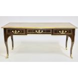 Louis XV-style writing desk having bronze mounts and tooled leather top, labeled Baker Furniture