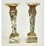 Pair of 19th century style French grey and white marble pedestals, having bronze figurehead