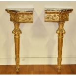 Pair of Louis XVI giltwood corner console tables with purple and white marble tops, 37 1/2" H x 21