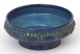 Former East Germany Strehla pottery bowl, decorated with green applied design on blue glaze, 18cms