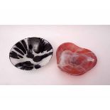 Two Studio Glass bowls with stylised designs, one with a smoky white design on red ground, the other
