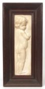 Plaster plaque of a child in oak frame, 43cms x 12cms