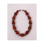 Bakelite, bead and gilt metal vertebrae design necklace, 420mm long