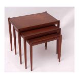Set of three mid-century Danish teak nesting tables, of graduated sizes, one stamped beneath Made in