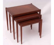 Set of three mid-century Danish teak nesting tables, of graduated sizes, one stamped beneath Made in