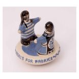 Bernard Moss Pottery figure, black and blue decorated advertising figure for Heal's Fabrics,