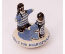 Bernard Moss Pottery figure, black and blue decorated advertising figure for Heal's Fabrics,