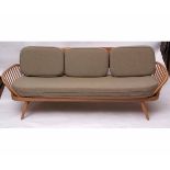 Retro mid-century Ercol light elm day-bed with surf board back, raised on splayed tapering legs,