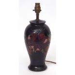 Moorcroft lamp base with tube lined design of anemones, the base with factory mark and monogram,