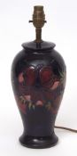 Moorcroft lamp base with tube lined design of anemones, the base with factory mark and monogram,