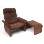 De Sade leather upholstered retro reclining chair and foot stool
