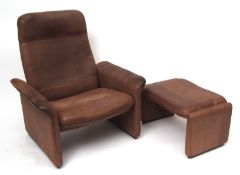 De Sade leather upholstered retro reclining chair and foot stool