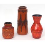 Group of three pieces of West German pottery with a red glazed and applied design, the largest 27cms