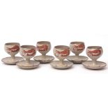 Group of six Welhouse goblets and saucers, with a brown design on a stippled grey ground, 12cms high