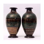 Large pair of Studio Pottery ovoid vases with green lustre design, the bases with signature for