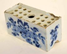 Delft flower brick decorated with floral decoration and mark of No 6 to base (extensive chipping),