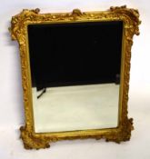 Victorian gilt plasterwork framed wall mirror with decorative corners and bevelled glass, 45cms wide