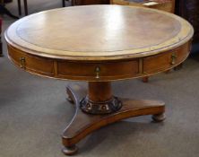 19th century oak drum table fitted with four drawers and four faux drawers with brass droplet