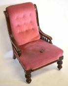 Victorian mahogany framed nursing chair with pink Dralon upholstered seat and button back on