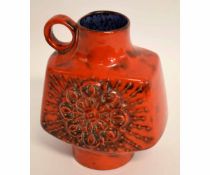 Red ground West German pottery type vase impressed number 720/25, decorated in a red glaze with loop