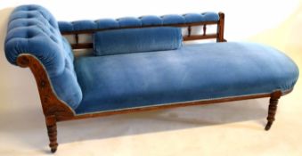 Edwardian mahogany framed chaise longue with blue Dralon upholstery with spindle back and carved