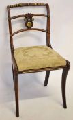 Regency period rosewood simulated dining chair with parcel gilded splat back and sabre legs
