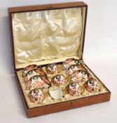 Boxed set of Royal Crown Derby coffee cups and saucers, one cup a/f, decorated in Imari style, the