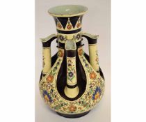 Unusual Continental pottery vase with polychrome decorations, the baluster body with four small
