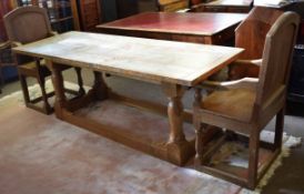 20th century light oak refectory type table with planked top on four turned supports, together