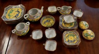 Oriental tea service, the yellow ground body decorated with dragons chasing a flaming pearl