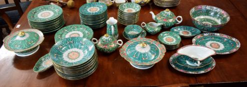 Extensive Oriental dinner service with green ground decoration and applied butterflies with