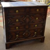 18th century oak four full width drawer chest with geometric panelled drawers with replacement brass