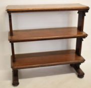 19th century mahogany three-tier buffet with planked ends with scrolling supports raised on four bun