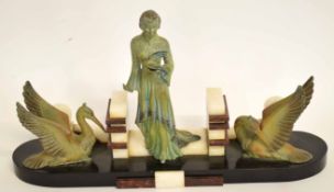 Art Deco style lady flanked by two pelicans with onyx style borders