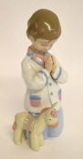 Lladro figure of a young girl at prayer with a donkey by her side, 19cms high
