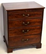 Early 19th century mahogany four full width drawer chest with brushing slide above, with brass