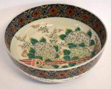 Large 19th century Japanese porcelain bowl decorated in polychrome enamels with a floral design