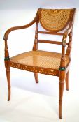 Decorative painted carver chair with cane back and seat