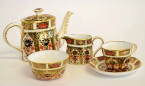 Collection of miniature Crown Derby tea pot, sugar bowl and milk jug together with a miniature cup