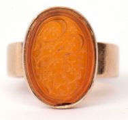 Antique carnelian intaglio ring, the oval intaglio bezel set in a plain polished yellow metal
