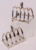 Two George VI four-slice toast racks with rectangular base and shaped frame and with cast and