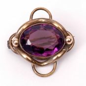 Antique amethyst brooch, large oval shaped faceted amethyst, 20 x 15mm, is set in a plain polished