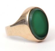 Gent's modern yellow metal and green hardstone signet ring, the oval polished green panel set in